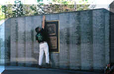 Loren Jim Atwood touching the name of Loren James Atwood